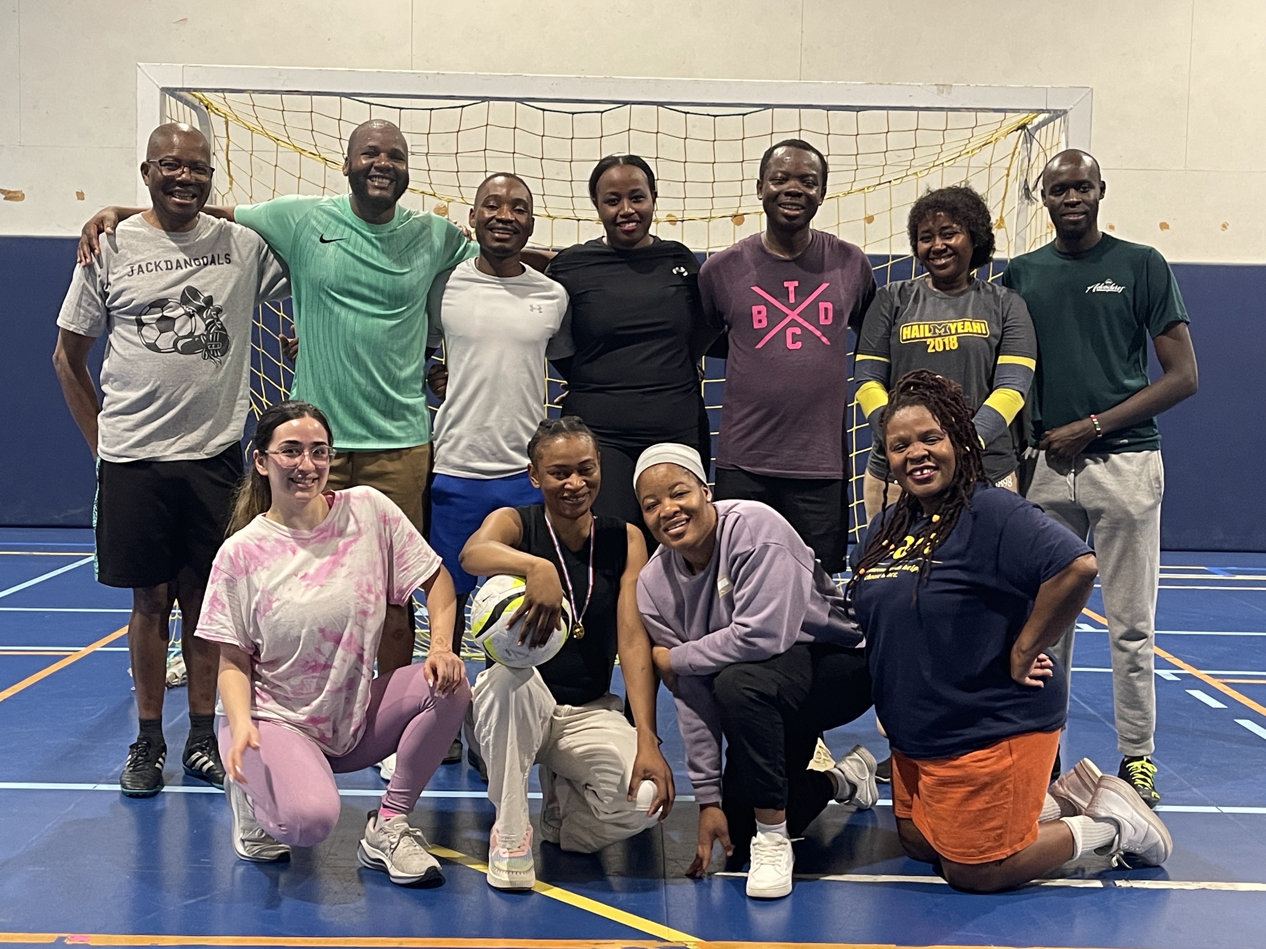 UMAPS group photo in front of an African Studies Center display.